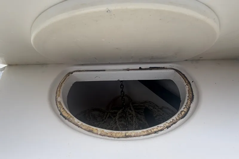Slide: The Image of Anchor storage compartment on a 2000 Pro-Line 32 Express boat. - 16