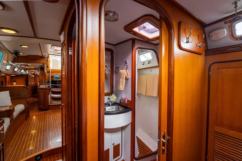 Slide: The Image of Luxurious interior of 2008 Passport Vista 515 Center Cockpit yacht with wood finishes. - 32
