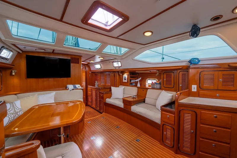 Slide: The Image of Luxurious interior of 2008 Passport Vista 515 Center Cockpit yacht with wood finish and seating area. - 21