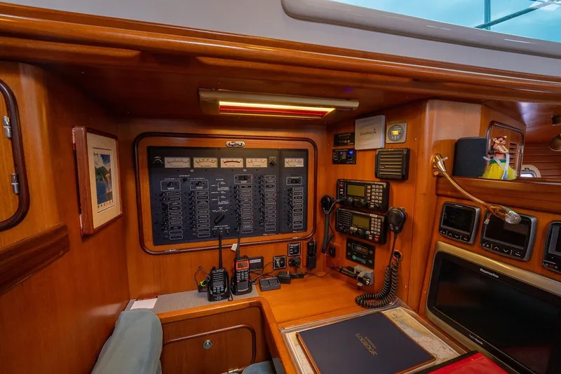 Slide: The Image of Control panel of a 2008 Passport Vista 515 Center Cockpit yacht, featuring navigation and communication equipment. - 28
