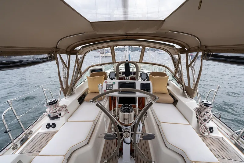 Slide: The Image of Luxurious 2008 Passport Vista 515 Center Cockpit yacht interior with steering wheel and navigation equipment. - 13