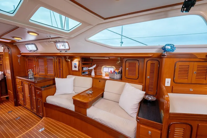 Slide: The Image of Luxurious interior of 2008 Passport Vista 515 Center Cockpit yacht with wooden cabinetry and seating. - 23