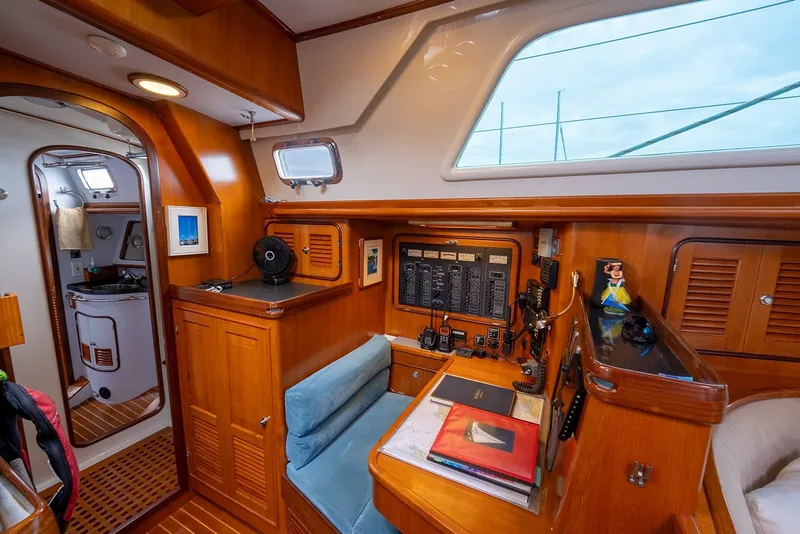 Slide: The Image of Interior of 2008 Passport Vista 515 Center Cockpit with navigation station and wooden cabinetry. - 27
