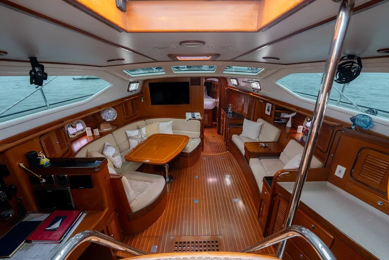 Slide: The Image of Luxurious interior of 2008 Passport Vista 515 Center Cockpit yacht with elegant wood finish. - 18