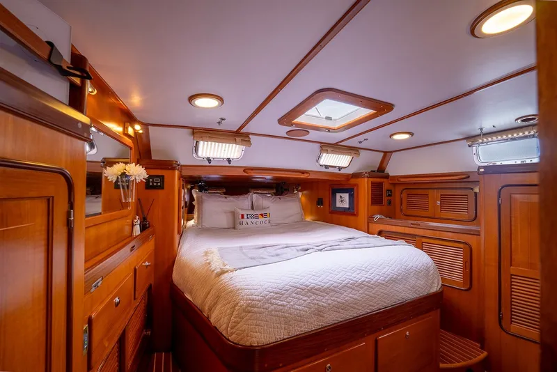 Slide: The Image of Luxurious cabin interior of 2008 Passport Vista 515 Center Cockpit yacht, featuring elegant wood finishes. - 25