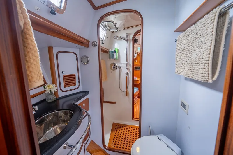 Slide: The Image of Luxurious bathroom in 2008 Passport Vista 515 Center Cockpit yacht, featuring modern fixtures and elegant design. - 26