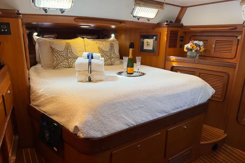 Slide: The Image of Luxurious cabin interior of 2008 Passport Vista 515 Center Cockpit yacht with elegant bedding. - 17