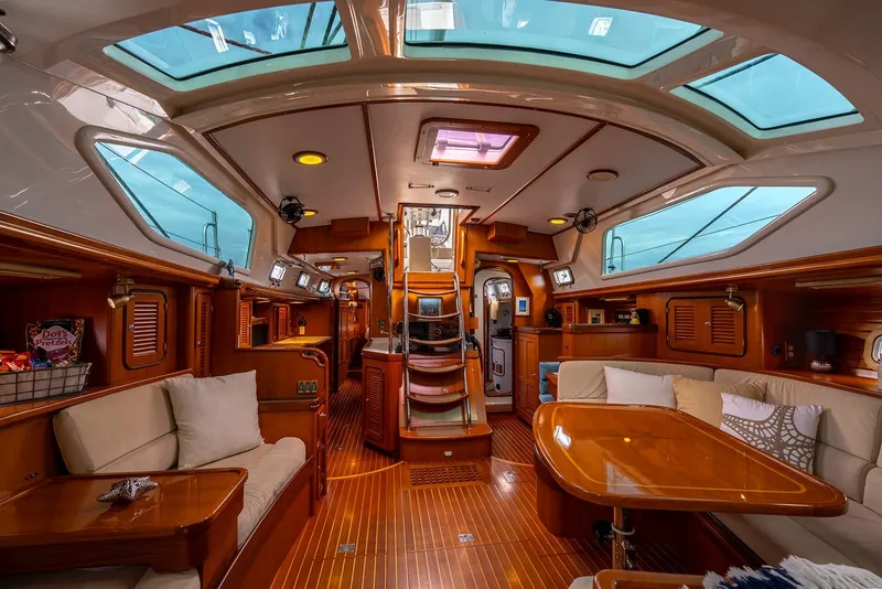 Slide: The Image of Luxurious interior of 2008 Passport Vista 515 Center Cockpit yacht with elegant wood finish. - 19