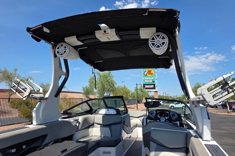 Slide: The Image of 2018 Supra SA 400 boat interior with speakers and seating under a clear sky. - 5