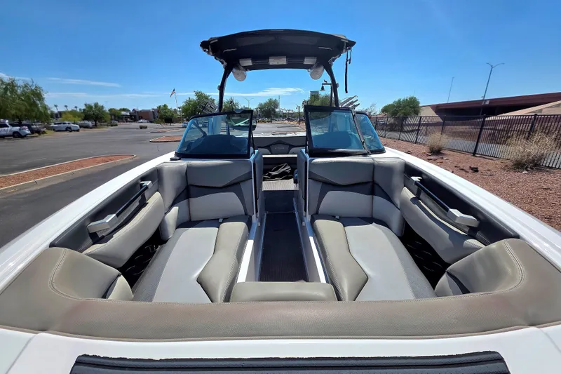 Slide: The Image of 2018 Supra SA 400 boat interior with spacious seating and sleek design under a clear blue sky. - 4
