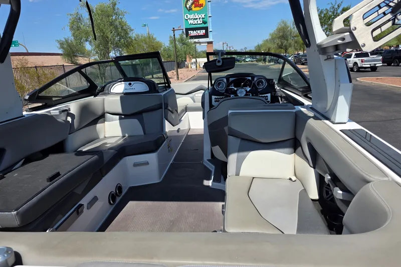 Slide: The Image of Interior of a 2018 Supra SA 400 boat with seating and dashboard. - 2