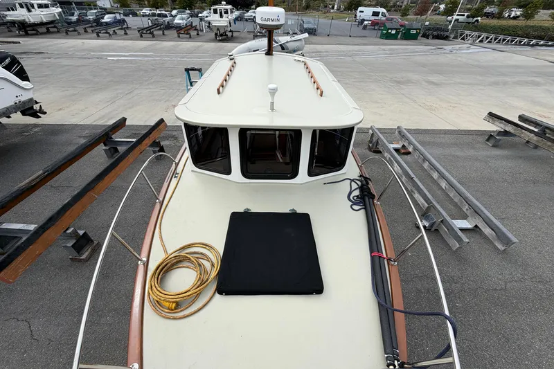 Slide: The Image of Top view of a 2000 Devlin Surf Scoter boat on a trailer in a marina. - 15