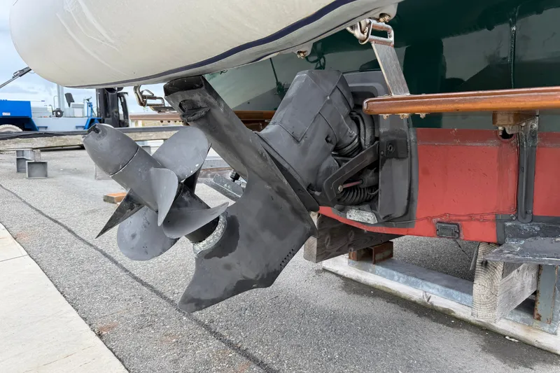 Slide: The Image of Outboard motor of a 2000 Devlin Surf Scoter boat on a trailer. - 17