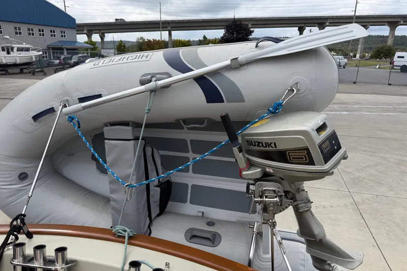 Slide: The Image of Inflatable boat with Suzuki outboard motor on a Devlin Surf Scoter, 2000 model. - 16