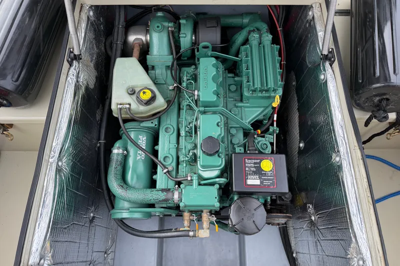 Slide: The Image of Engine compartment of a 2000 Devlin Surf Scoter boat with a Volvo Penta engine. - 14