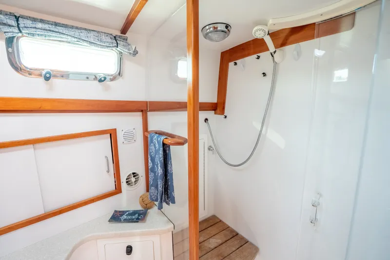 Slide: The Image of Interior of 2008 Sabre 42 Hard Top Express yacht, featuring a modern shower area. - 28