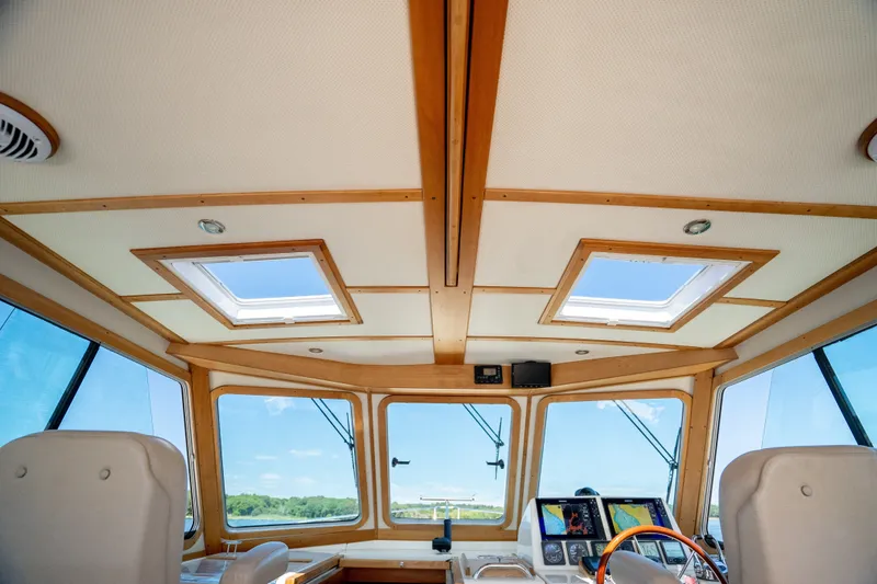 Slide: The Image of Interior view of 2008 Sabre 42 Hard Top Express yacht helm with skylights and navigation equipment. - 21