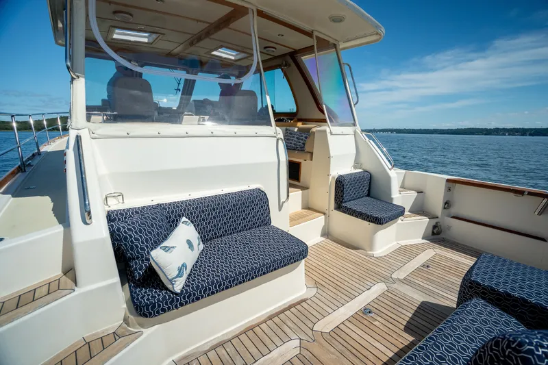 Slide: The Image of 2008 Sabre 42 Hard Top Express yacht with elegant seating and scenic ocean view. - 12