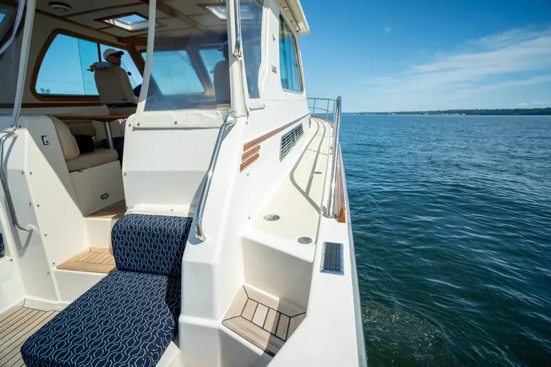 Slide: The Image of 2008 Sabre 42 Hard Top Express yacht cruising on calm blue waters. - 14