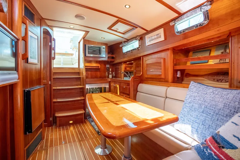 Slide: The Image of Luxurious interior of 2008 Sabre 42 Hard Top Express yacht with wooden finishes and cozy seating. - 22