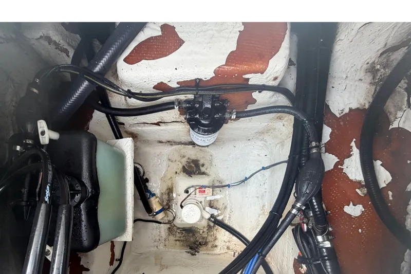 Slide: The Image of 1999 Hydra-Sports 20 Bay Sport engine compartment with visible wiring and components. - 31