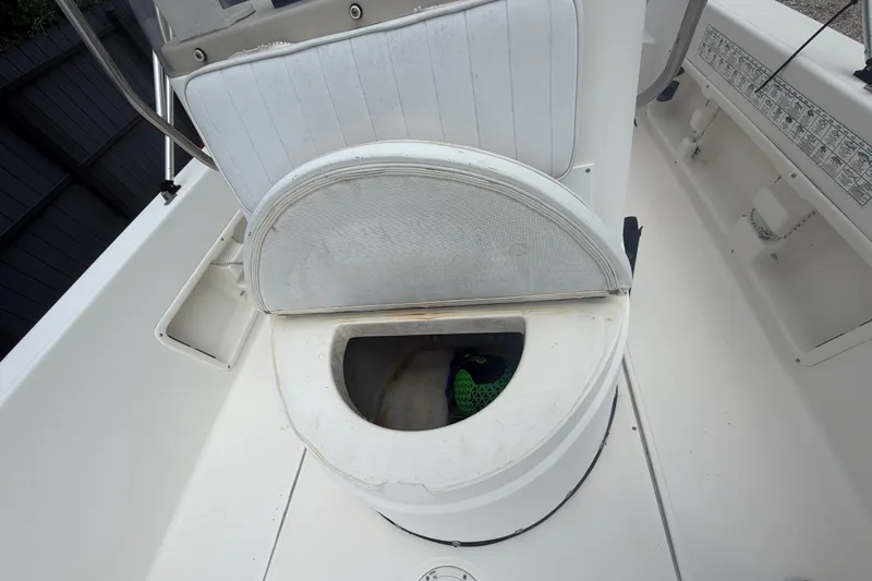 Slide: The Image of 1999 Hydra-Sports 20 Bay Sport boat seat storage compartment open, revealing interior space. - 34