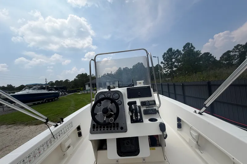 Slide: The Image of 1999 Hydra-Sports 20 Bay Sport boat interior with steering wheel and control panel. - 32