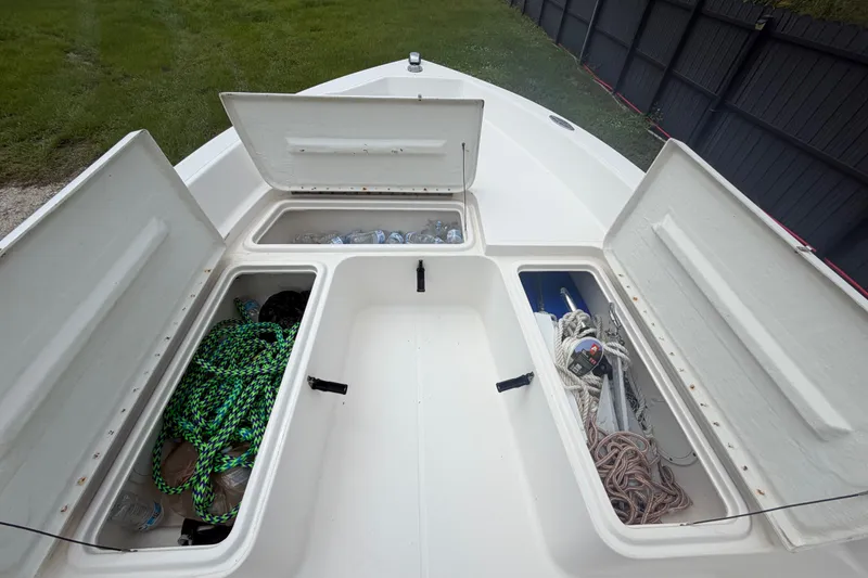 Slide: The Image of 1999 Hydra-Sports 20 Bay Sport boat storage compartments with ropes and supplies. - 35