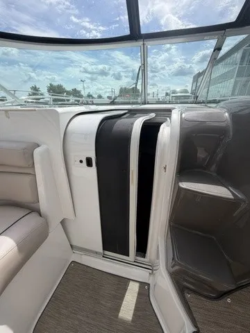 Slide: The Image of The image shows the cockpit of a 2015 Rinker 360 Express Cruiser with comfortable seating and a clear sky. - 14