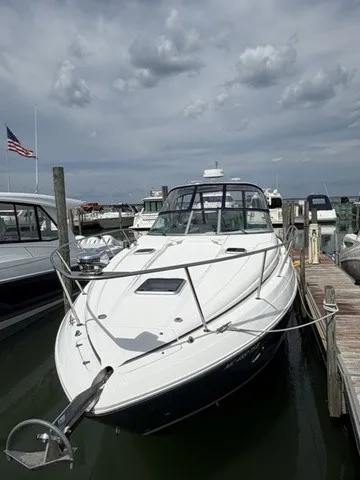 Slide: The Image of 2015 Rinker 360 Express Cruiser docked, featuring sleek design and spacious deck. - 22