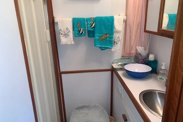 Slide: The Image of Bathroom interior of 1993 Harbor Master 450 Coastal Cruiser with nautical-themed towels. - 34