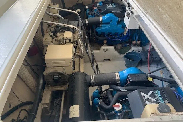 Slide: The Image of Engine compartment of a 1993 Harbor Master 450 Coastal Cruiser, showcasing mechanical components. - 14