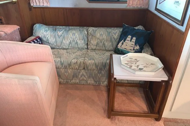 Slide: The Image of Interior of 1993 Harbor Master 450 Coastal Cruiser with sofa, chair, and decorative tray. - 30