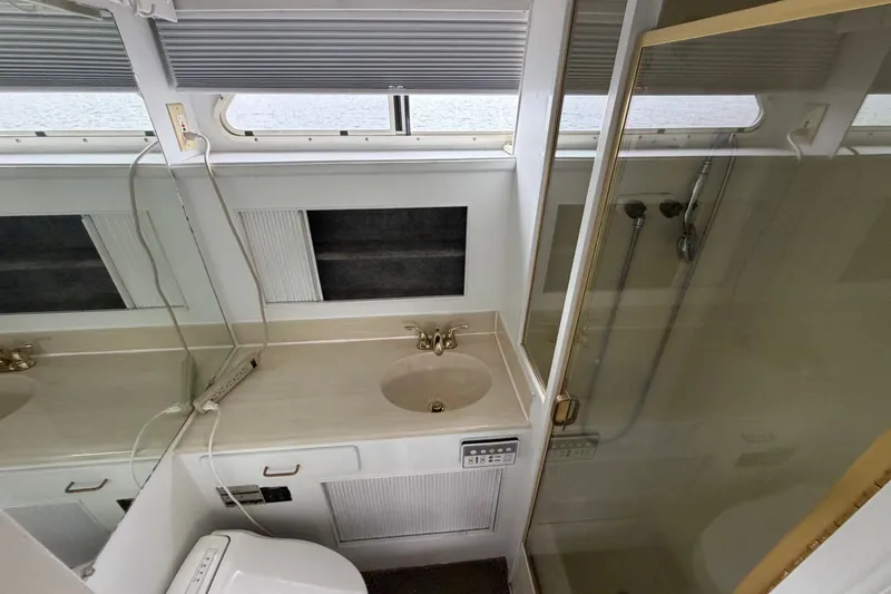 Slide: The Image of Bathroom interior of 1988 Tollycraft 44 Cockpit Motor Yacht with sink and shower. - 38