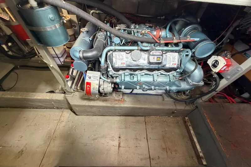 Slide: The Image of Engine room of a 1988 Tollycraft 44 Cockpit Motor Yacht, showcasing detailed machinery. - 42