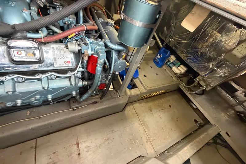 Slide: The Image of Engine room of a 1988 Tollycraft 44 Cockpit Motor Yacht, showcasing mechanical components. - 45