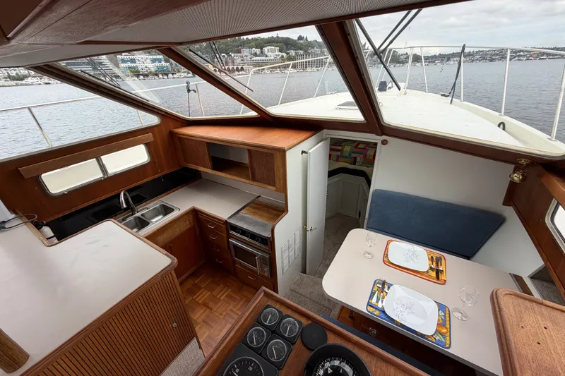 Slide: The Image of Interior of 1988 Tollycraft 44 Cockpit Motor Yacht with kitchen and dining area. - 29
