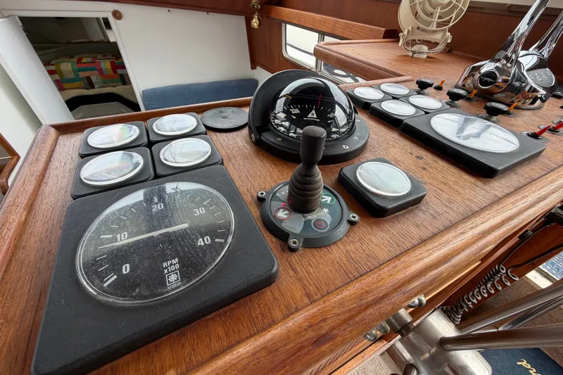 Slide: The Image of Control panel of a 1988 Tollycraft 44 Cockpit Motor Yacht with gauges and instruments. - 26