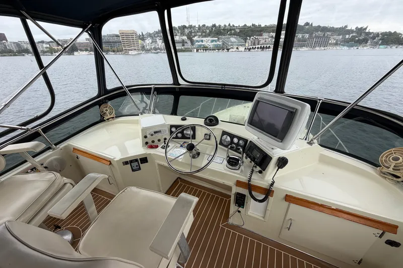 Slide: The Image of Cockpit of 1988 Tollycraft 44 Cockpit Motor Yacht with steering wheel and navigation equipment. - 17