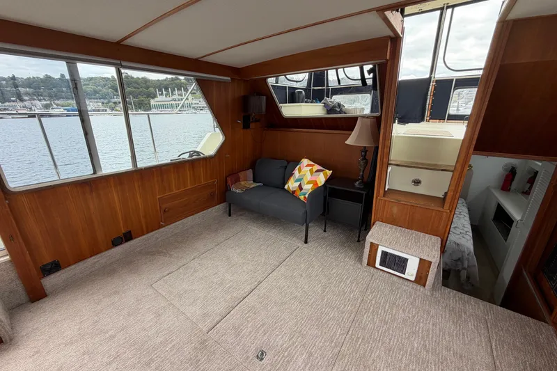 Slide: The Image of Interior of 1988 Tollycraft 44 Cockpit Motor Yacht with cozy seating and scenic windows. - 24