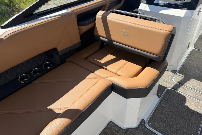 Slide: The Image of Luxurious tan leather seating in 2025 Cobalt R8 Outboard boat interior. - 22