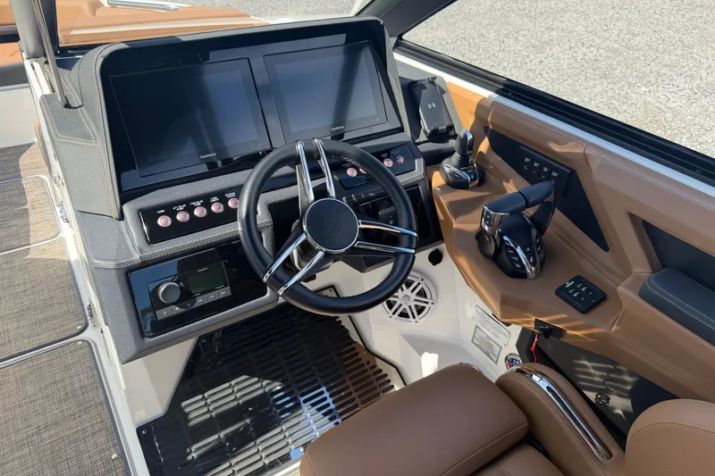 Slide: The Image of 2025 Cobalt R8 Outboard boat dashboard with dual screens and modern controls. - 14