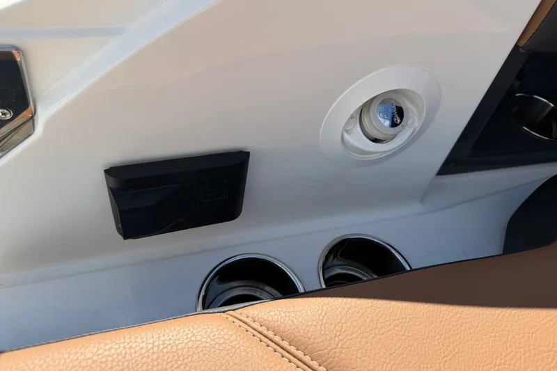 Slide: The Image of Interior detail of 2025 Cobalt R8 Outboard boat with cup holders and leather trim. - 32