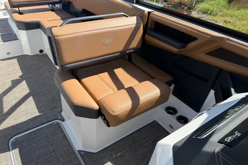 Slide: The Image of 2025 Cobalt R8 Outboard boat interior with tan leather seating and modern design. - 16