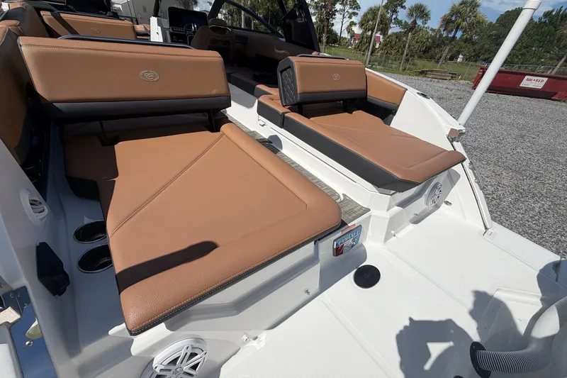 Slide: The Image of 2025 Cobalt R8 Outboard boat interior with tan seating and modern design. - 23