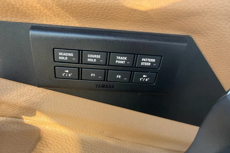Slide: The Image of Control panel of a 2025 Cobalt R8 Outboard boat with Yamaha navigation buttons. - 27