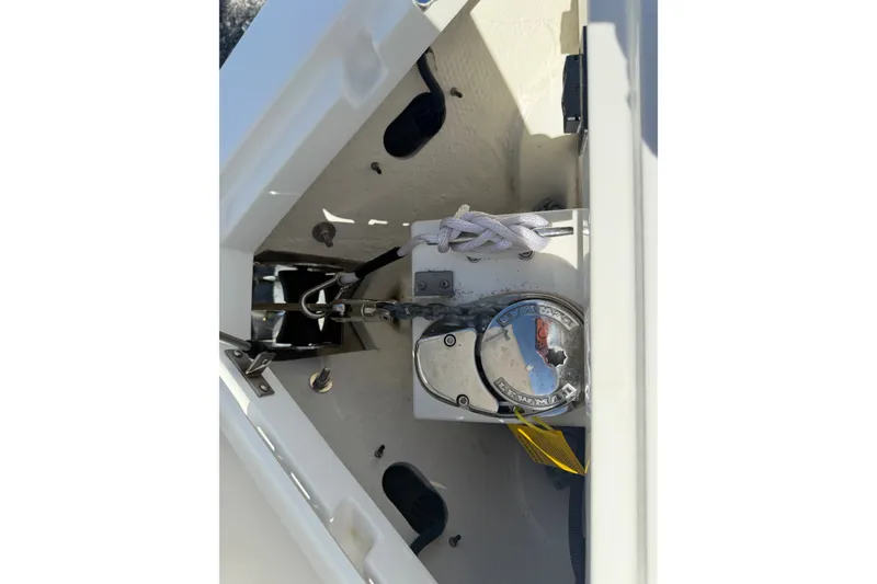 Slide: The Image of Anchor compartment of 2025 Cobalt R8 Outboard boat with winch and rope. - 10