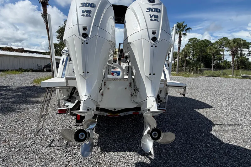 Slide: The Image of 2025 Cobalt R8 Outboard with dual 300 V6 engines, parked on gravel. - 4