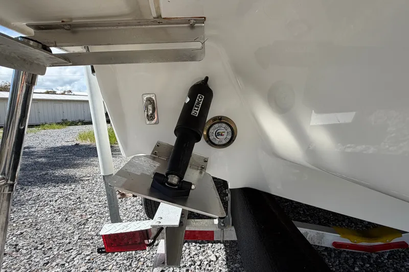 Slide: The Image of 2025 Cobalt R8 Outboard boat detail showing trim tab and hydraulic system. - 11