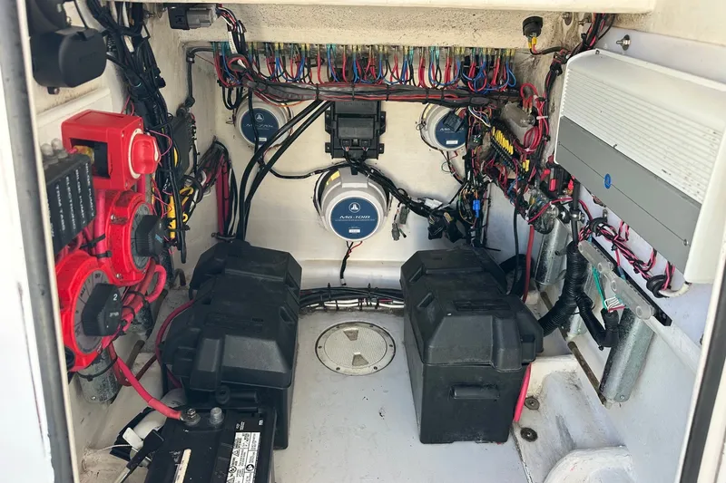 Slide: The Image of Electrical system of a 2005 Contender 23 Tournament boat, featuring batteries and wiring. - 11